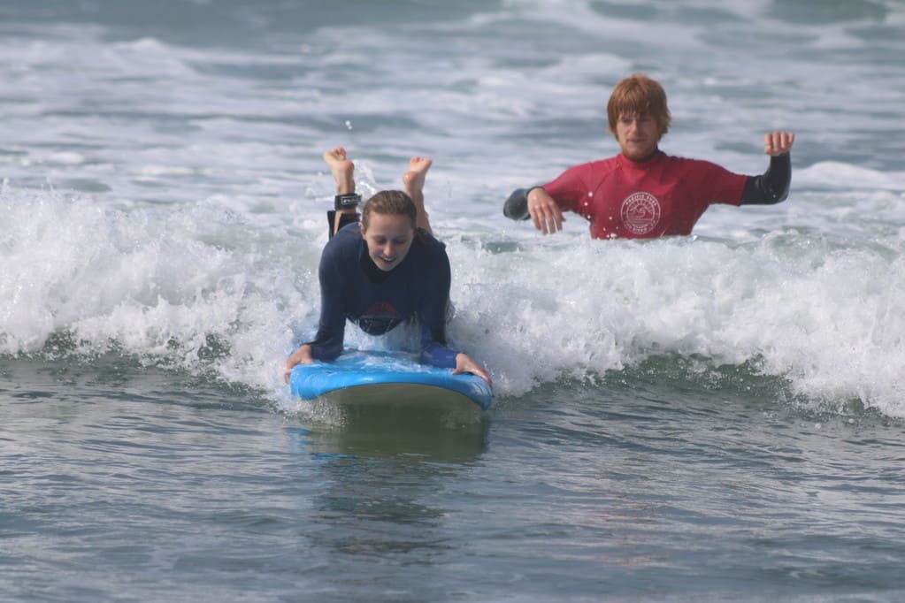 Girl learning to surf